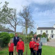 Farndon Primary School pupils with Ed Barnston (left) and head teacher Andy Walker and teaching assistant Kim Barnes.