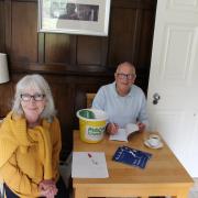Author Peter Stanley - pictured alongside his daughter - signs copies of his new book at Boughton Hall.
