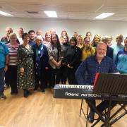 Musical Director Tim Jones with the cast of Tip Top Productions Christmas Concert which will be staged at St Mary's Creative Space.