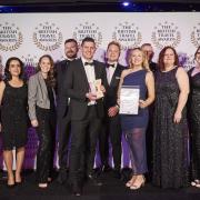Sykes Holiday Cottages accept their award from the British Travel Awards.