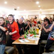 Youngsters cheering on Luke Littler at the St Helens Darts Academy, where the Warrington hero honed his skills
