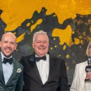 From left, comedian Tom Allen with Tim Bird and Mary McLoughlin as they win the Best Drinks Act at the Publican Awards 2024